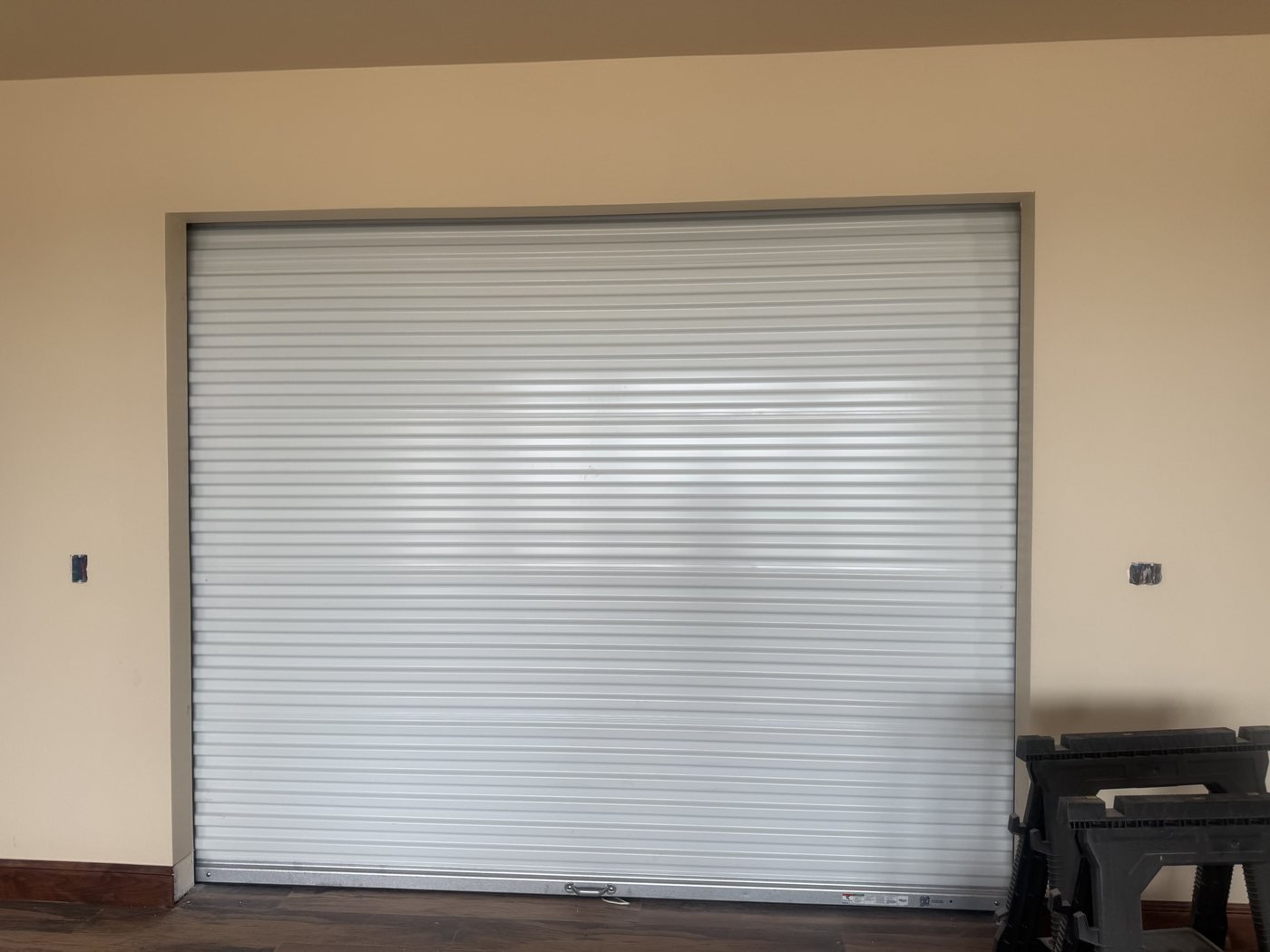 White rolling steel door in an interior commercial opening